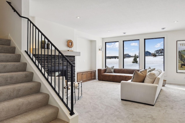 living room featuring a water view and light colored carpet