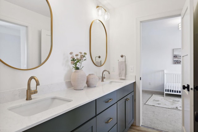 bathroom with vanity and wood-type flooring