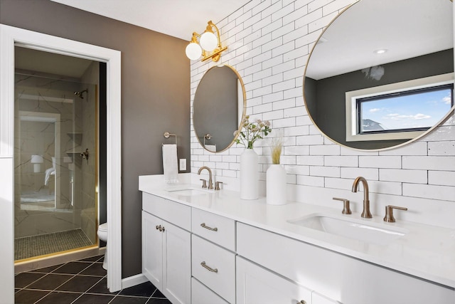 bathroom featuring vanity, tile patterned flooring, toilet, walk in shower, and tasteful backsplash