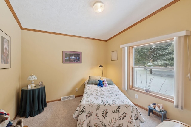 carpeted bedroom with lofted ceiling, ornamental molding, and a textured ceiling