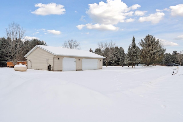 view of snow covered garage