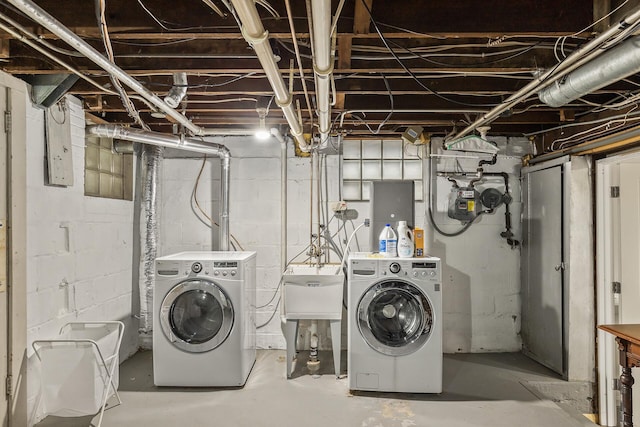 laundry room featuring separate washer and dryer and sink