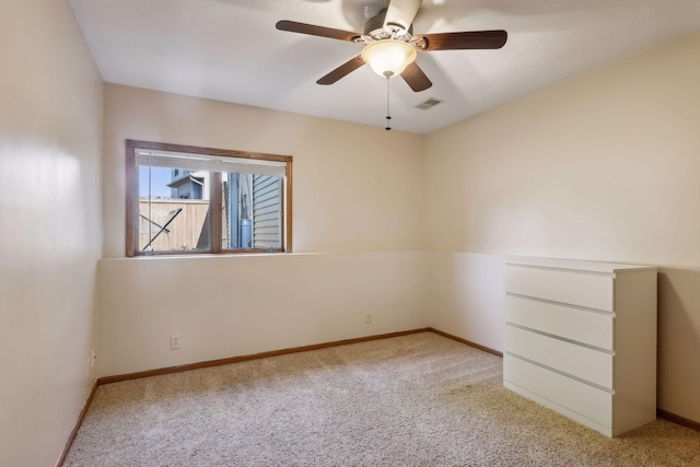 carpeted empty room with ceiling fan