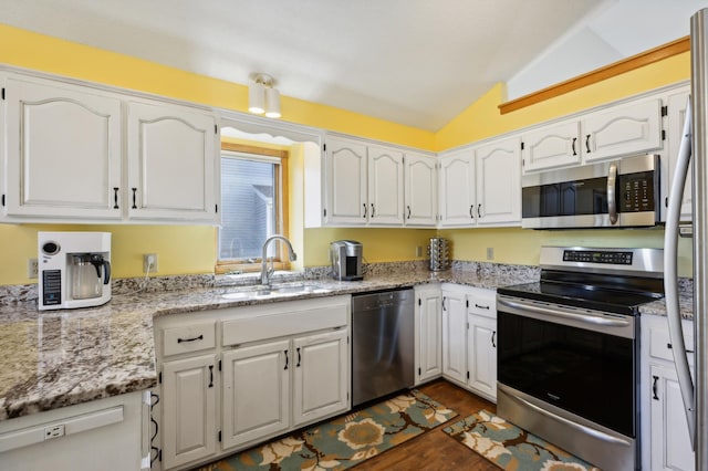 kitchen with sink, white cabinetry, and appliances with stainless steel finishes