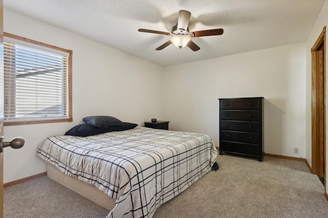 bedroom featuring ceiling fan and light carpet