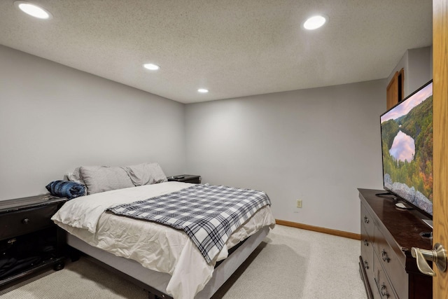 carpeted bedroom with a textured ceiling