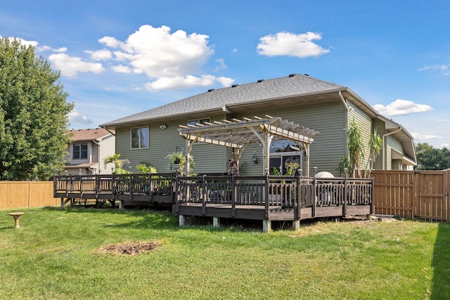 back of house featuring a pergola, a deck, and a lawn