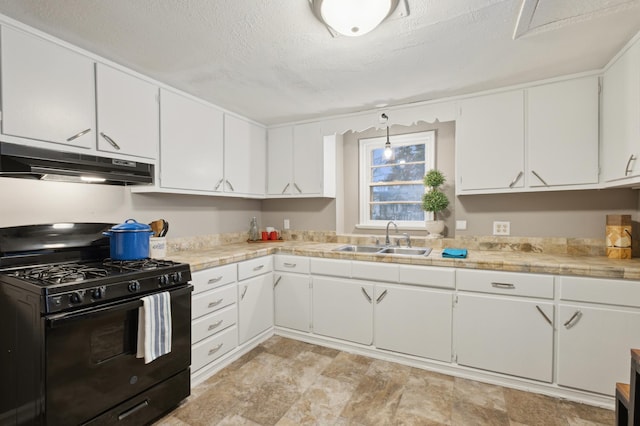 kitchen featuring black gas range, a textured ceiling, white cabinets, and sink