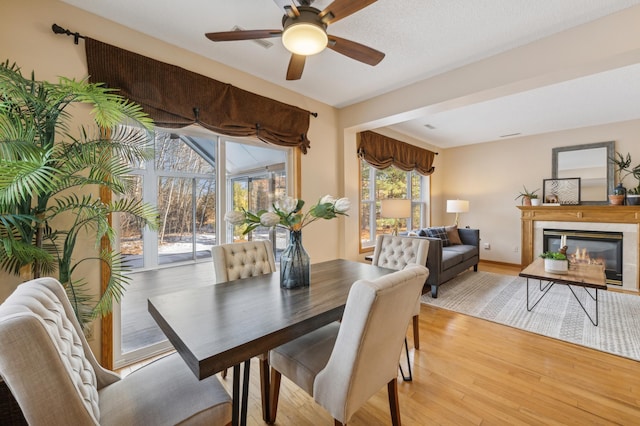 dining room featuring light hardwood / wood-style floors and ceiling fan