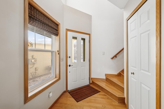 foyer entrance with light hardwood / wood-style flooring