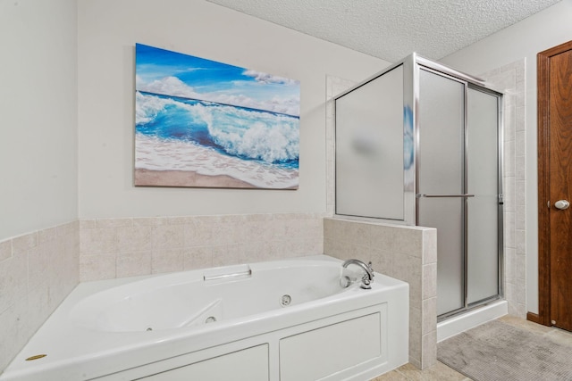 bathroom with tile patterned flooring, a textured ceiling, and independent shower and bath