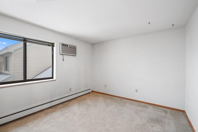 unfurnished room with a wall mounted air conditioner, a baseboard radiator, and light colored carpet