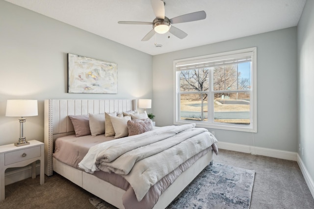 bedroom with carpet floors, baseboards, and a ceiling fan