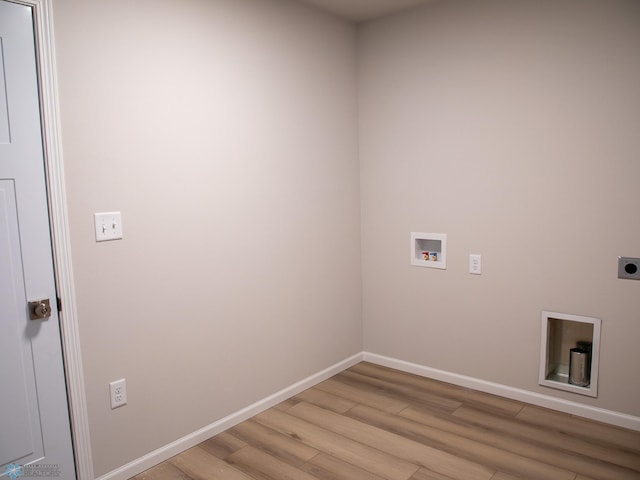 clothes washing area featuring washer hookup, hookup for an electric dryer, and light wood-type flooring