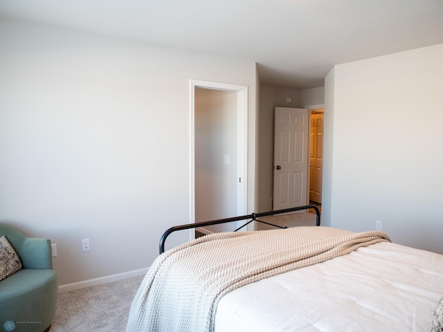 bedroom featuring light colored carpet