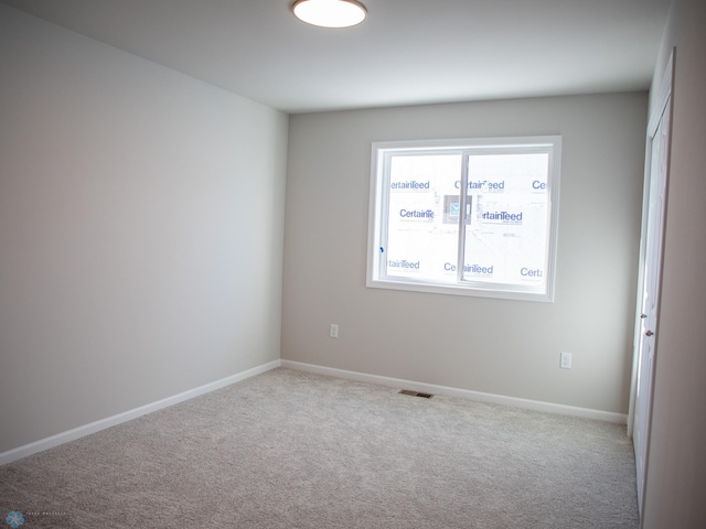 view of carpeted spare room