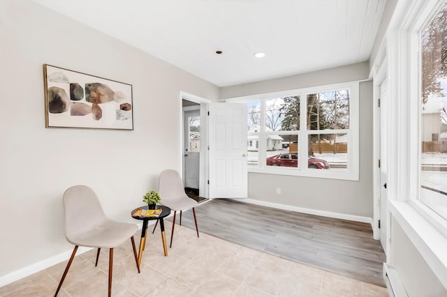 sitting room with light hardwood / wood-style flooring and a baseboard radiator