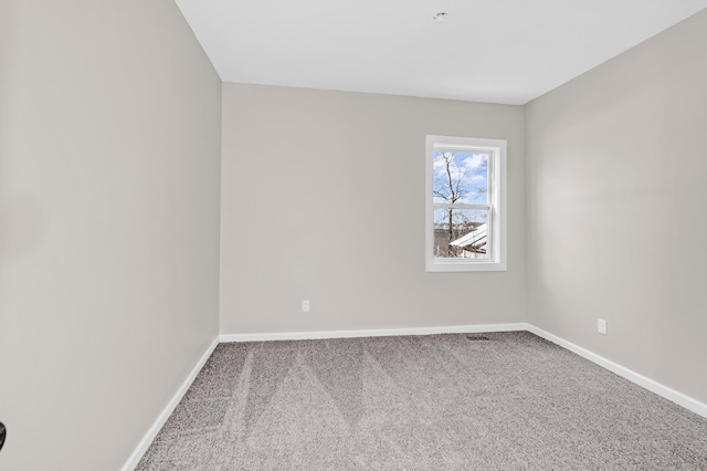 unfurnished room featuring carpet flooring