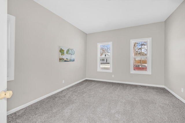 unfurnished room featuring carpet