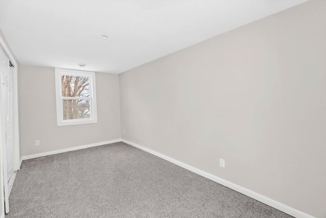 unfurnished room with carpet flooring