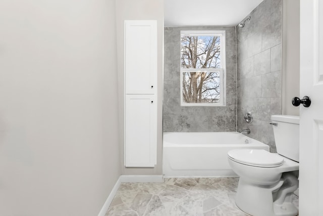 bathroom featuring toilet and shower / bathtub combination