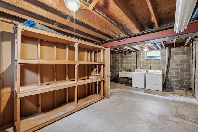 basement featuring sink and washing machine and clothes dryer