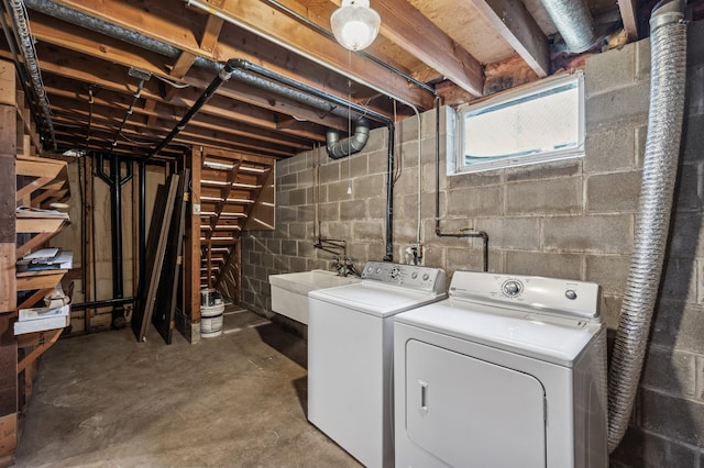 laundry room featuring sink and washer and clothes dryer