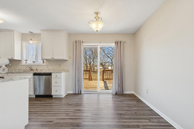 kitchen featuring dishwasher, white cabinets, dark wood finished floors, and baseboards