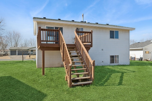 rear view of property with stairway, a wooden deck, and a yard