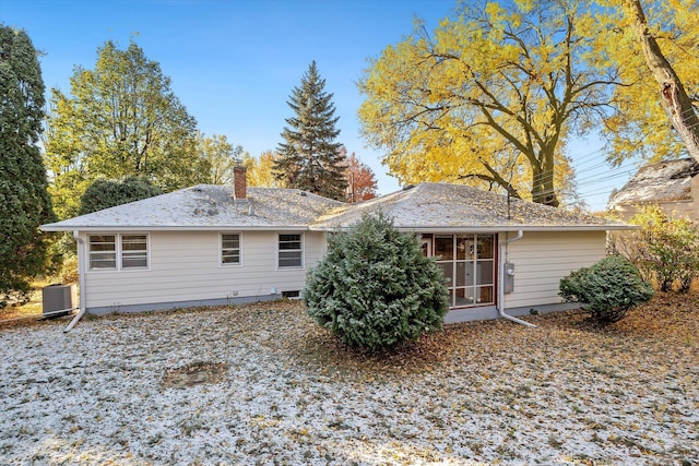 rear view of property featuring central AC unit