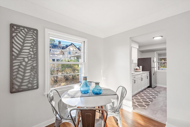 dining area featuring light wood-type flooring