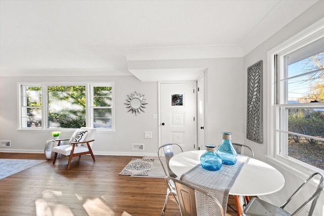 dining area with wood-type flooring