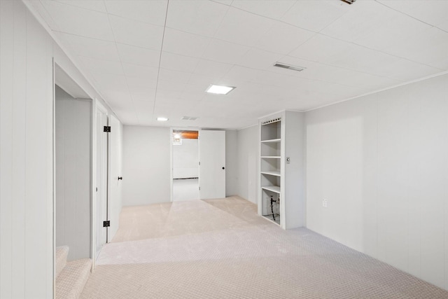 basement with light colored carpet