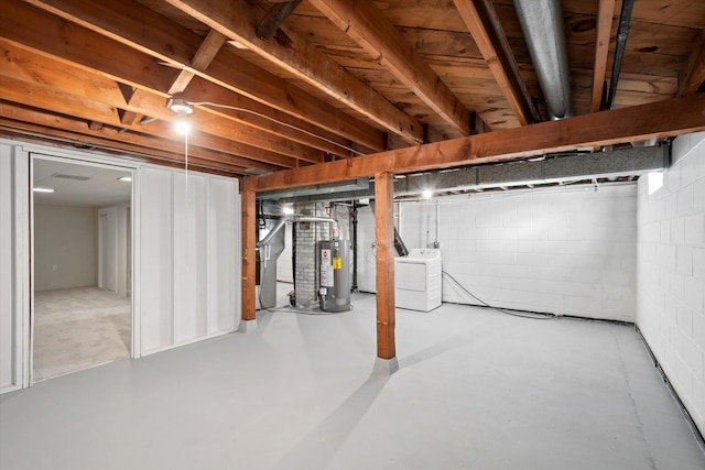 basement with separate washer and dryer and gas water heater