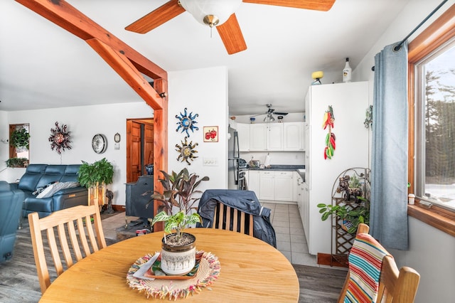 dining area with tile patterned floors and ceiling fan