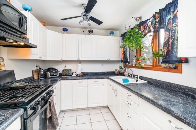 kitchen featuring ceiling fan, sink, light tile patterned floors, black range with gas cooktop, and white cabinets