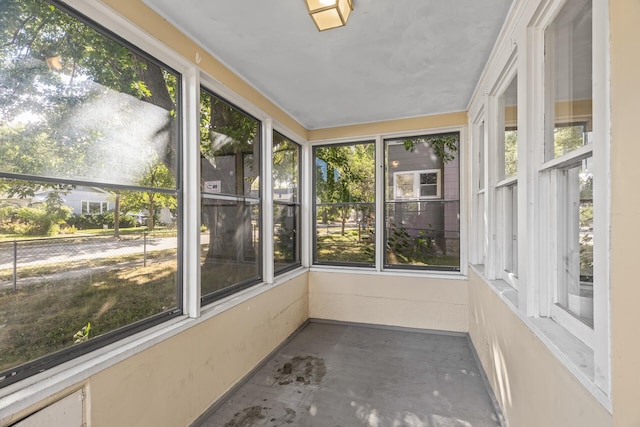 unfurnished sunroom featuring a wealth of natural light