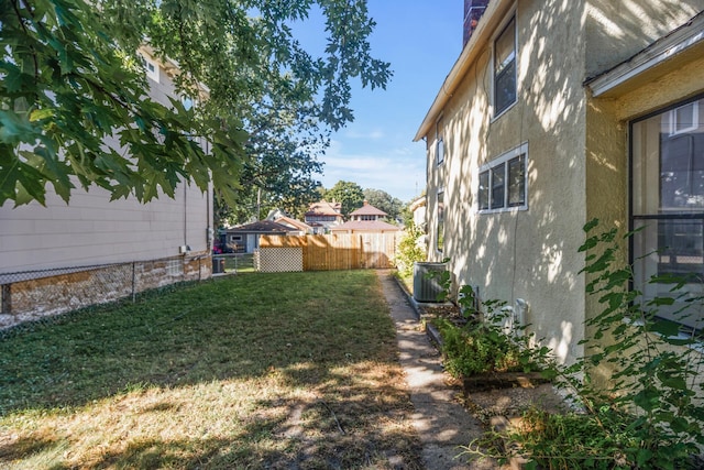 view of yard with central AC unit