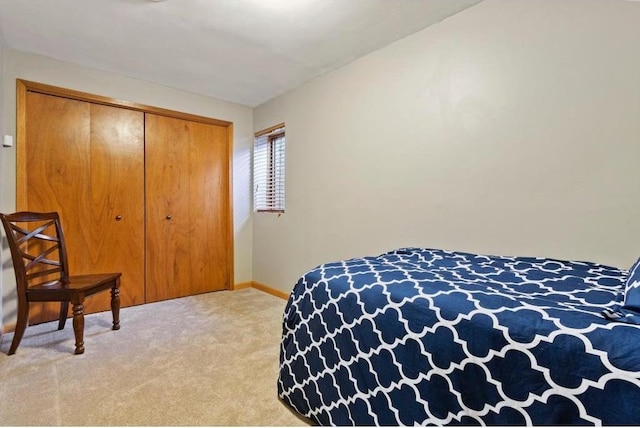 carpeted bedroom featuring a closet