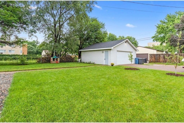 view of yard with an outbuilding and a garage