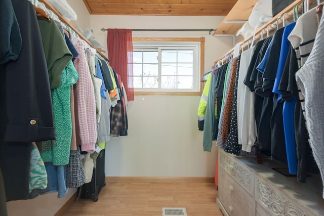 walk in closet featuring wood finished floors and visible vents