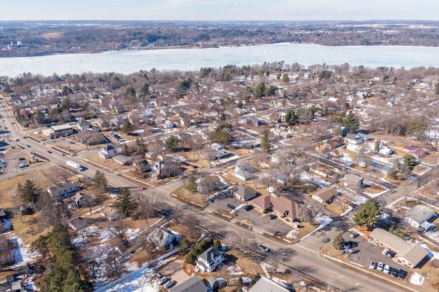 birds eye view of property with a water view and a residential view