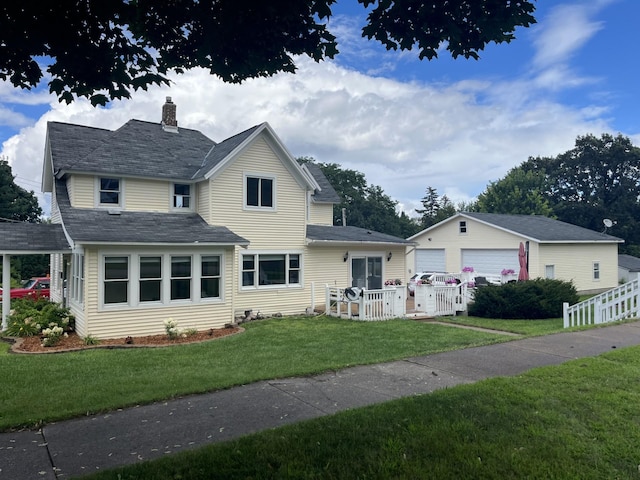 view of front of house featuring a garage and a front yard