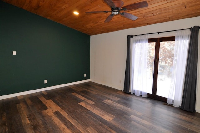 empty room with ceiling fan, wood ceiling, and dark hardwood / wood-style flooring