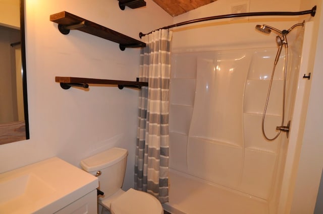 bathroom with vanity, walk in shower, and toilet