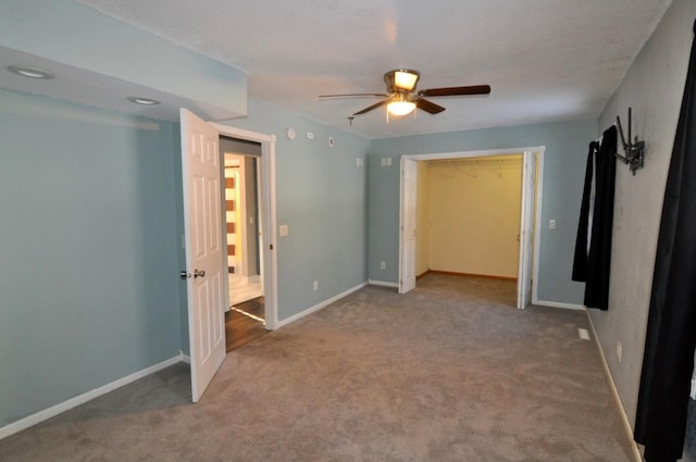 unfurnished bedroom with ceiling fan, a closet, and carpet