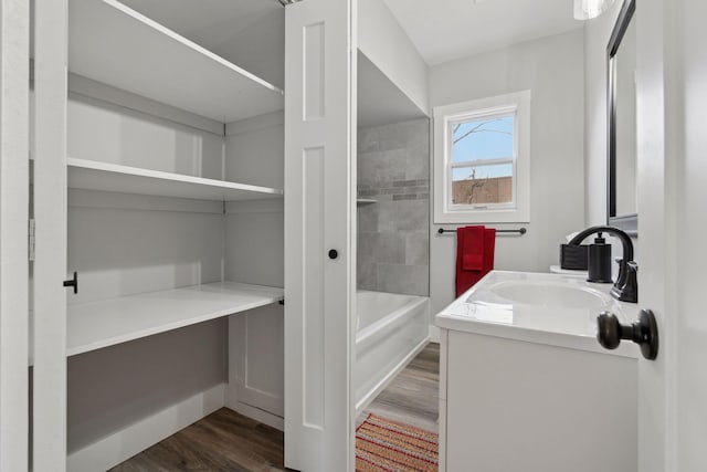 bathroom with hardwood / wood-style floors and vanity