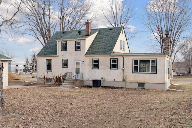 back of house featuring cooling unit