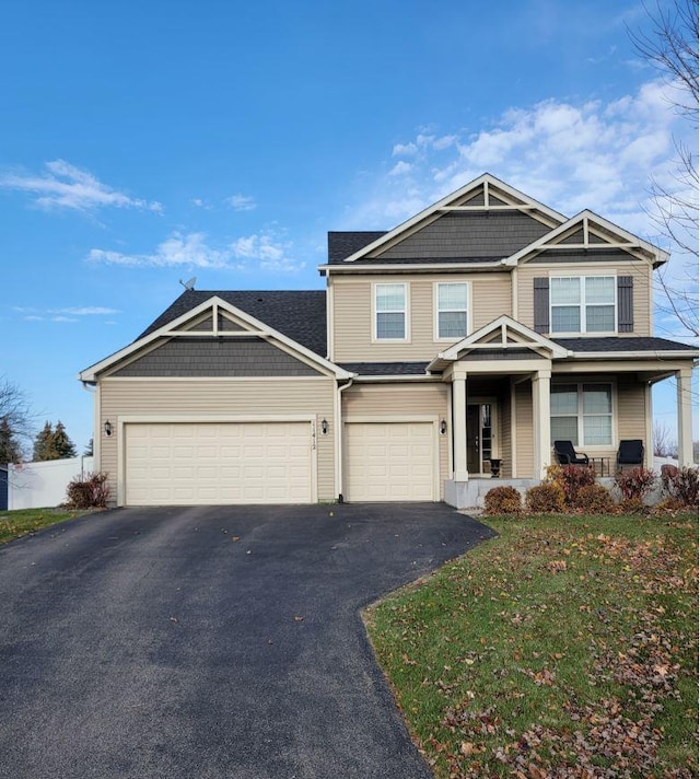 view of front of house with a porch and a front lawn