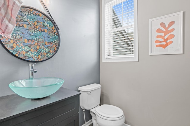 bathroom with toilet and vanity